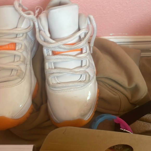 These are Jordan 11s low top. Orange and white. They need a good washing. - Picture 4 of 6